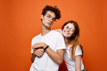 young couple on orange background