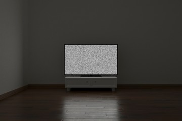 TV with noise in a dark empty room