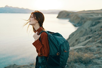 woman with a backpack in nature