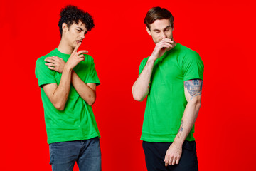 friends men in green t-shirt on a red background logo