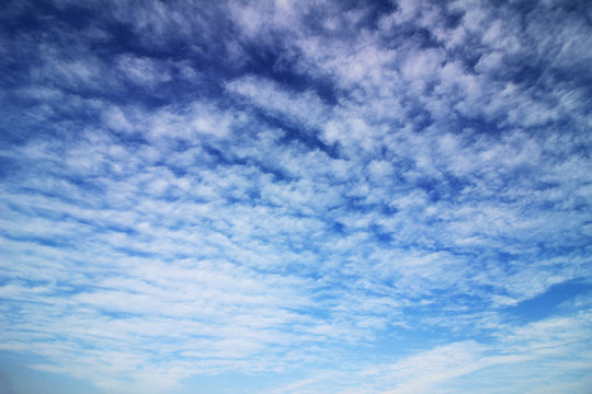  Cirrocumulus cloud spreading in the blue sky