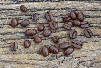 Roasted coffee on wood background..