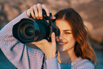 woman taking photo with digital camera