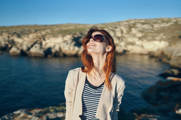 happy woman with glasses smiling sea summer