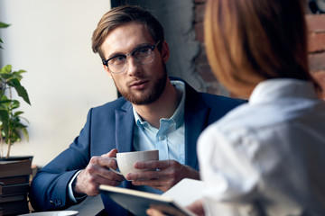 business colleagues in a cafe talks