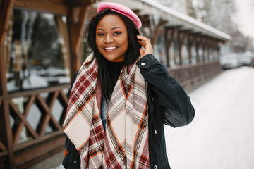 Elegant black girl in a winter city