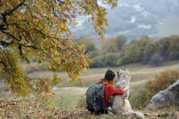 woman hugging a dog nature