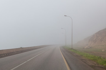 Coastal road near Salalah, Dhofar Province, Oman, during Khareef monsoon season