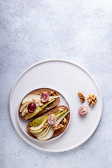Toasts with pears and honey on a white background