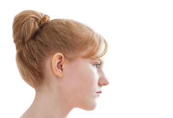 portrait of a teen girl in profile isolated on white