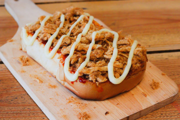 Toast bread with dried shredded pork and Chili Paste in square wood dish 