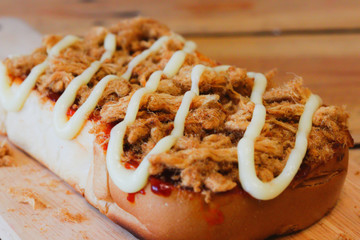 Toast bread with dried shredded pork and Chili Paste in square wood dish 