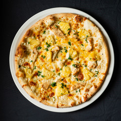 pizza on the black background