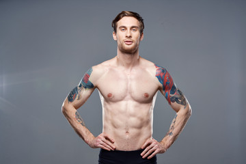 strong man with a tattoo on the body muscular