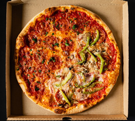 pizza on the black background