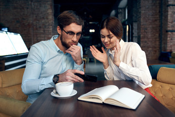 business people in a cafe talks project work