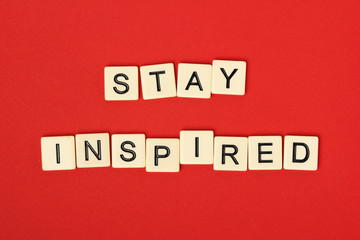 Inspirational sentence Stay inspired formed with game tiles