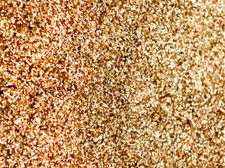 Gold sparkles. Gold glitter background. Gold background.