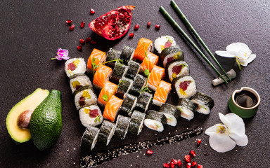 Rainbow Sushi set with salmon, eel, tuna, avocado, royal prawn, cream cheese Philadelphia, caviar tobica, chuka. Sushi menu. Japanese food