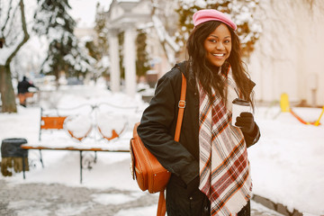 Elegant black girl in a winter city
