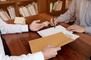 Business people signing contract making a deal with real estate agent Concept for consultant and home insurance concept.