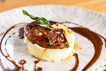 Mashed potato with meat and sauce