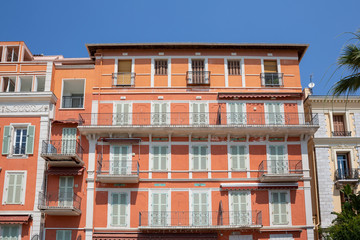 Beautiful balconies and shuttered windows in the mediterranean town of Menton, south of France