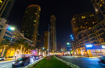 Fototapeta na wymiar Walk through the night streets of Dubai.