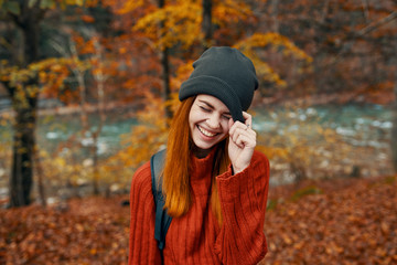 happy woman on a hike in autumn in nature