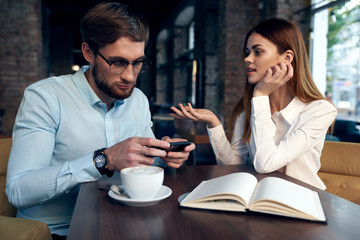 business colleagues in a cafe talk