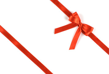 Shiny red silk ribbon on white background.