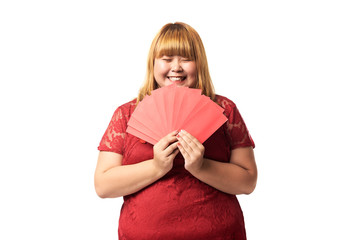 Asian woman holding ang pow or red packet monetary gift. Chinese new year concept.