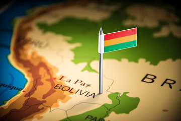 Bolivia marked with a flag on the map