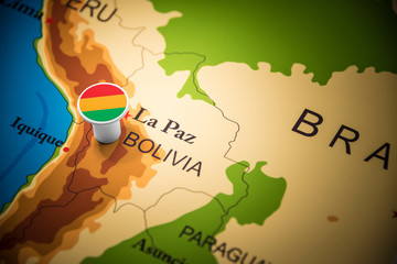 Bolivia marked with a flag on the map