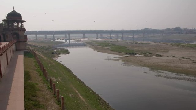 View of the Yamuna river and Agra city beyond as see from the magnificent Tomb of Itimad ud Daulah ka Maqbara, a Mughal mausoleum in Agra, India