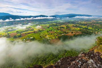 Naklejka premium Landscape sea of mist on high mountain in Nakornchoom, Phitsanulok province, Thailand.