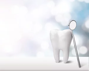 Fotobehang Tandarts Grote tand en tandartsspiegel op tafel