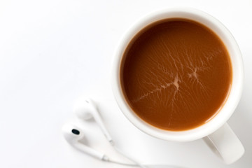coffee in white cup and  earphone isolated on white background