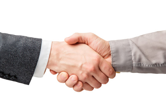 Business handshake and business people concepts. Two men shaking hands isolated on white background. Close-up image of a firm handshake between two colleagues