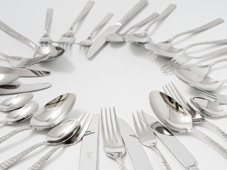 silverware forks spoons knives cutlery on a white background
