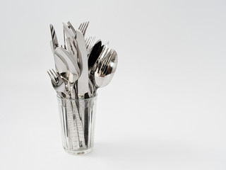 silverware forks spoons knives cutlery on a white background