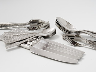 silverware forks spoons knives cutlery on a white background