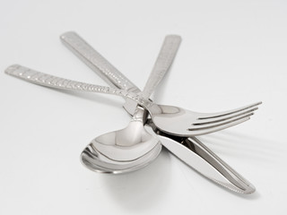 silverware forks spoons knives cutlery on a white background