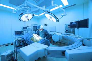 veterinarian surgery in operation room take with art lighting and blue filter