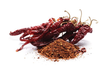 Dry spicy chili peppers and flakes, powder isolated on white background