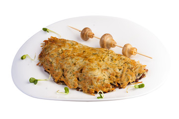 Potato pancakes with veal liver and mushrooms. Polish traditional dish. On white background