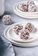 Cacao Date Energy Bites on a white blue background