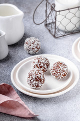 Cacao Date Energy Bites on a white blue background