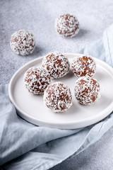 Cacao Date Energy Bites on a white blue background