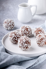Cacao Date Energy Bites on a white blue background
